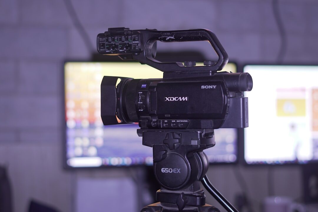 Close-up of professional video camera lens in a studio environment